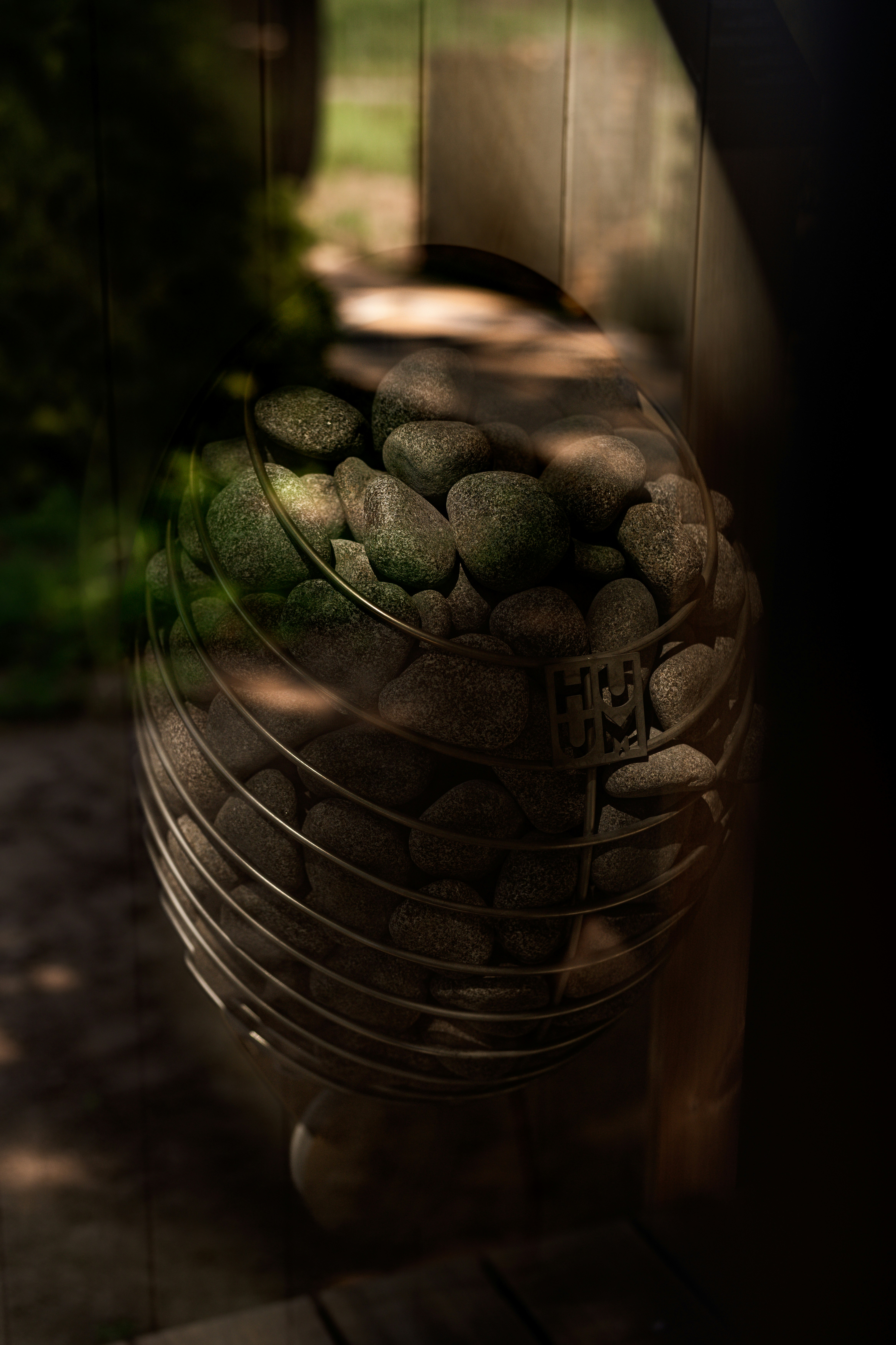 a bucket full of rocks sitting on top of a wooden table