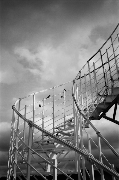 a black and white photo of a spiral staircase