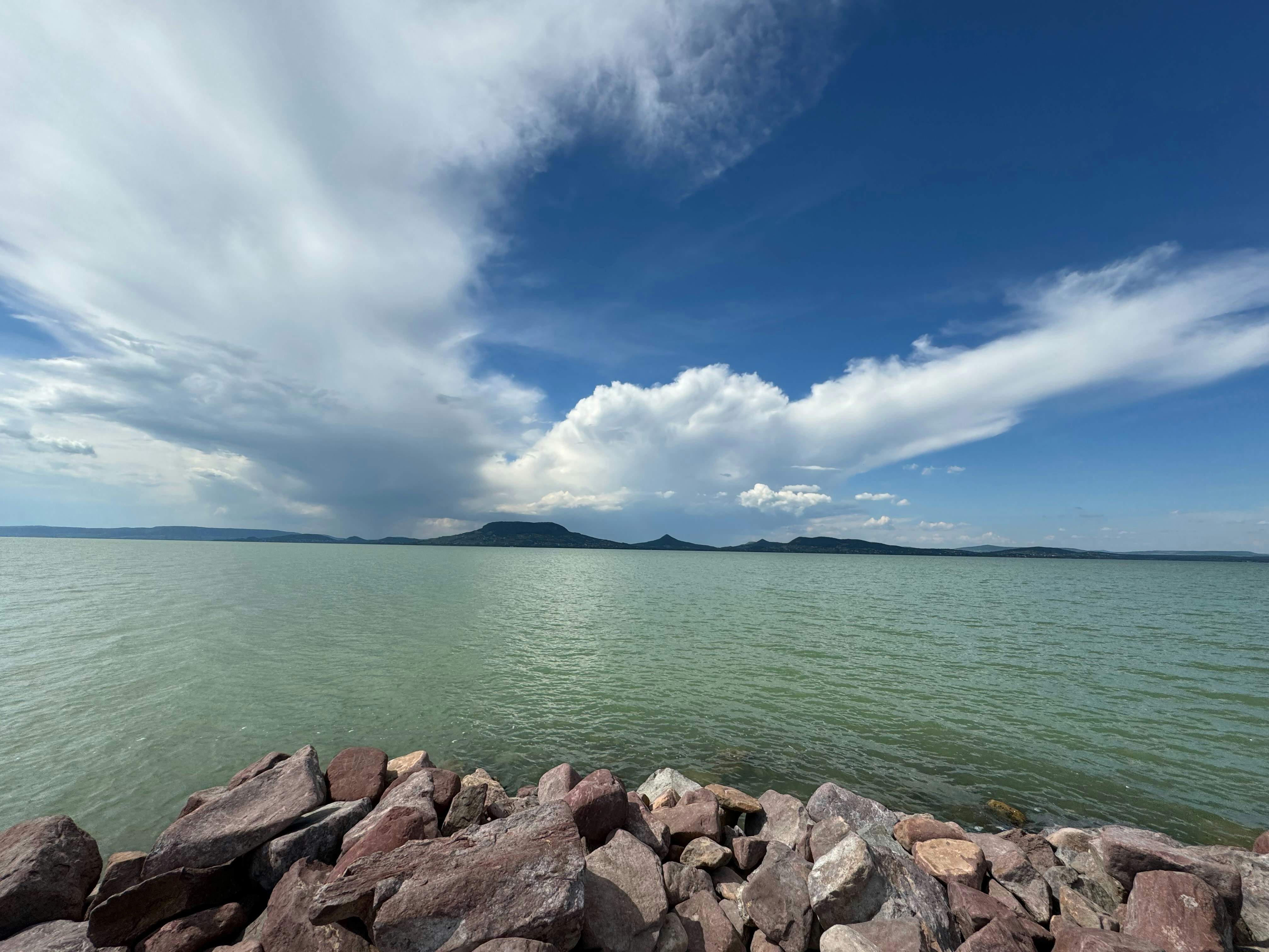 a large body of water surrounded by rocks