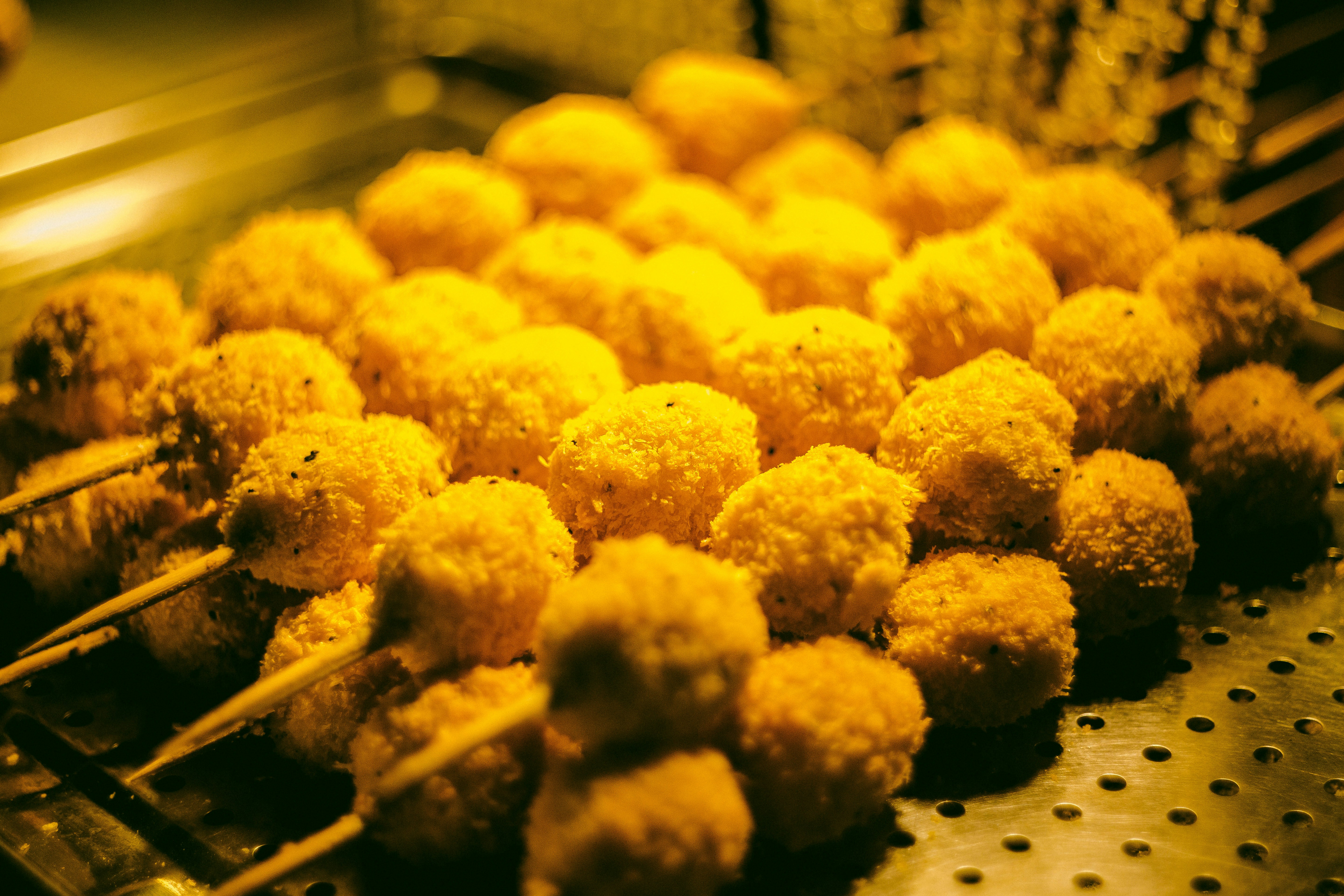 a bunch of food that is cooking on a grill