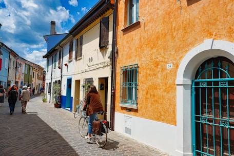 a person riding a bike down a street