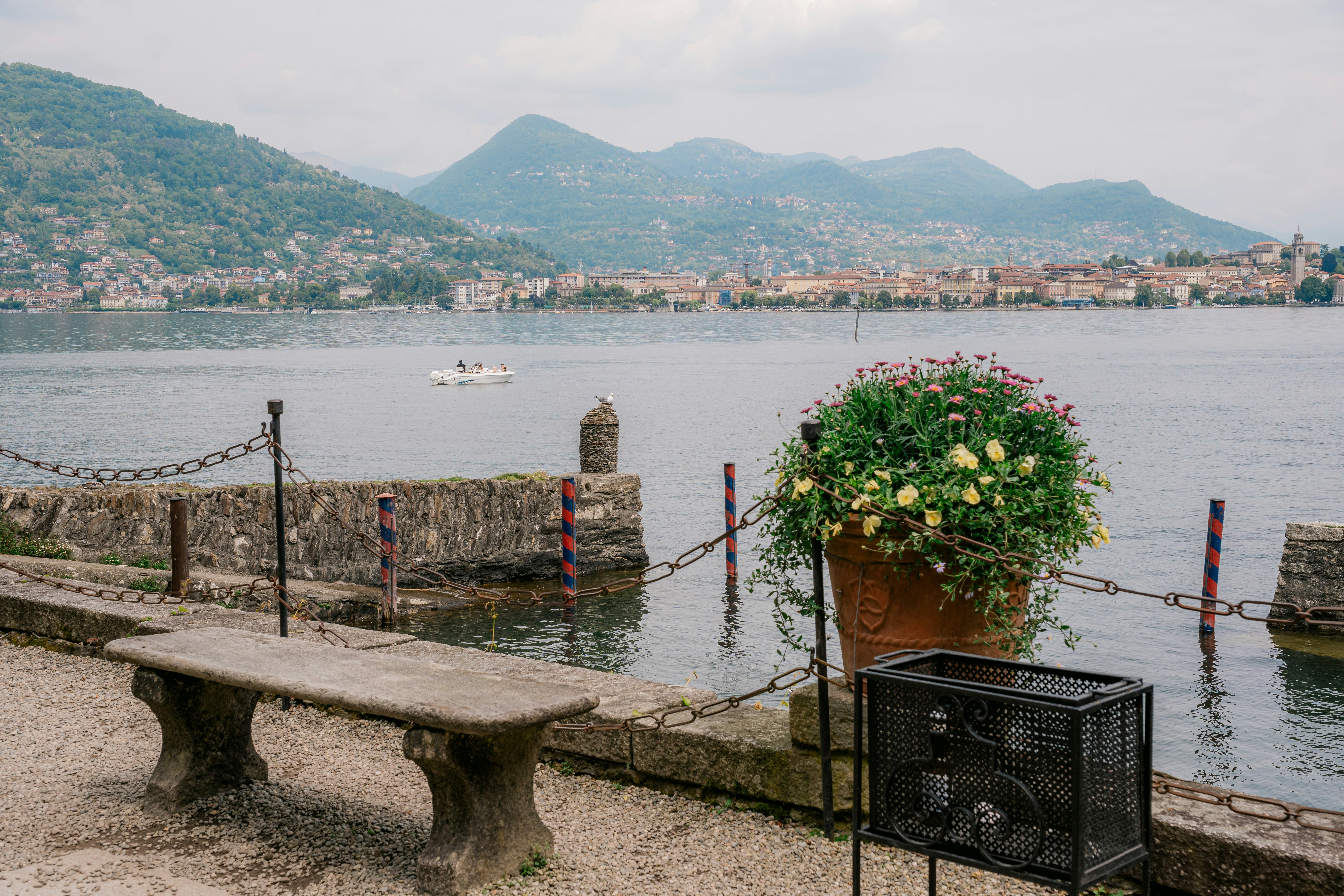 a wooden bench sitting next to a body of water