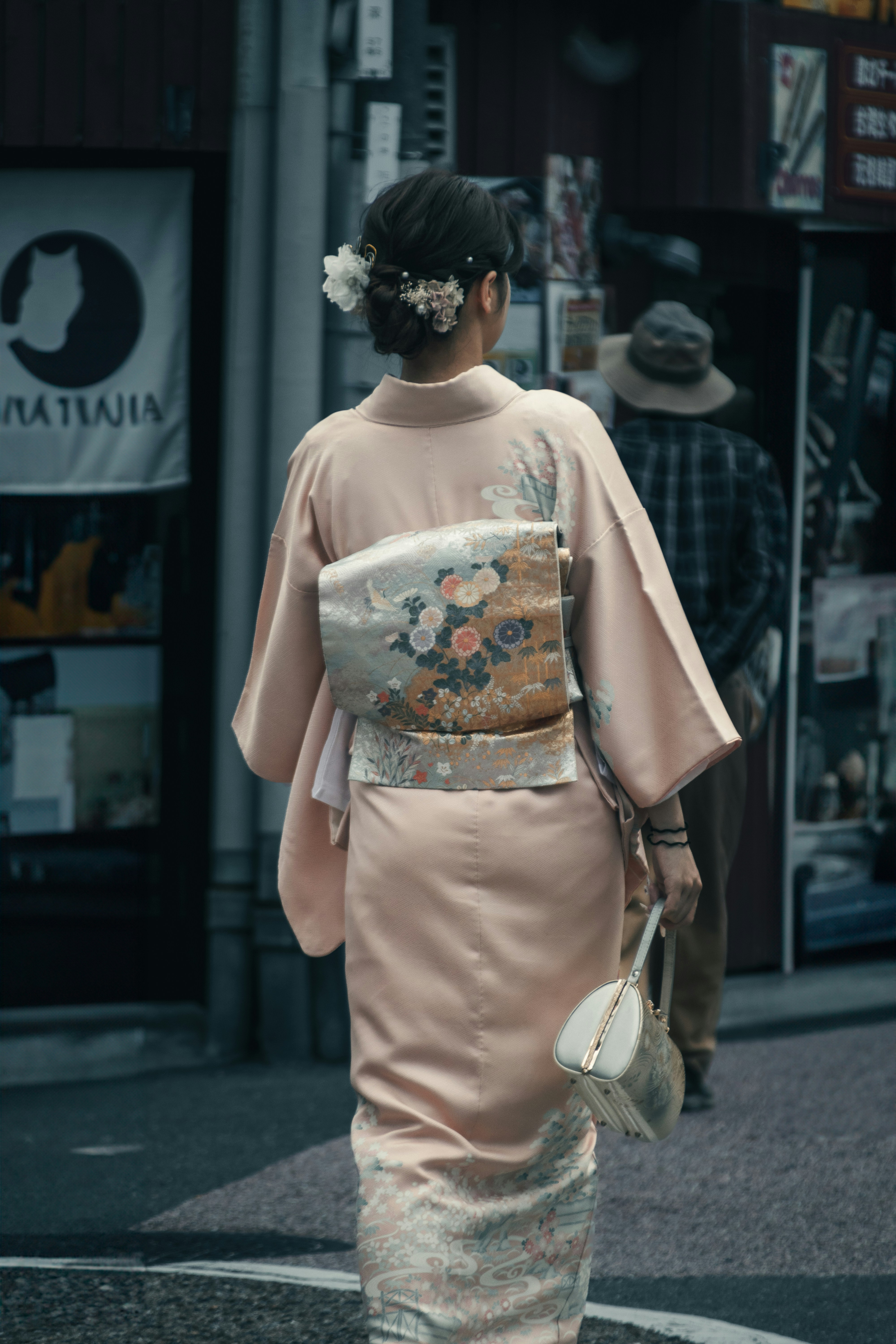 A woman in a kimono walking down the street photo – Free Grey Image on ...