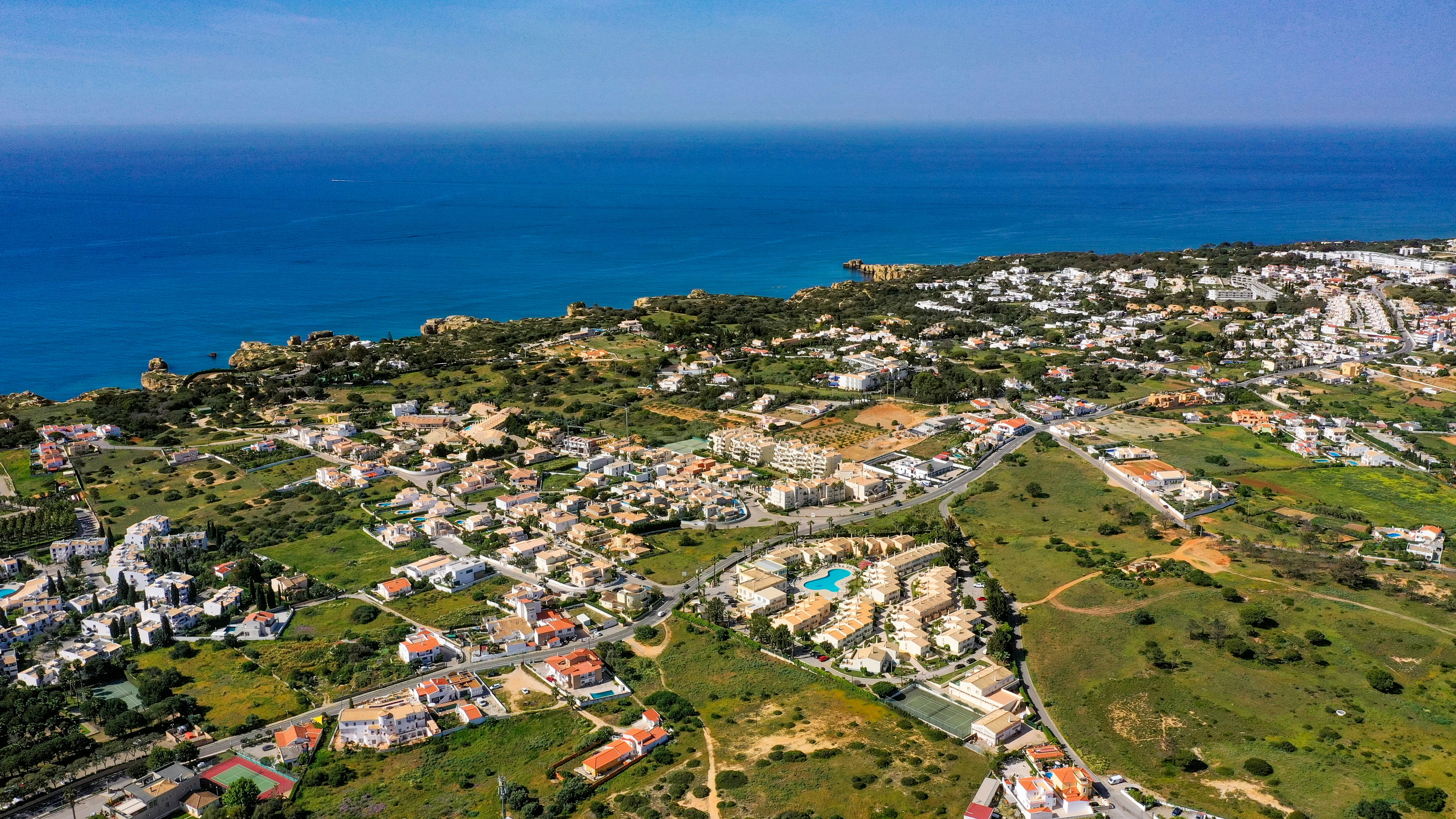 an aerial view of a city by the ocean