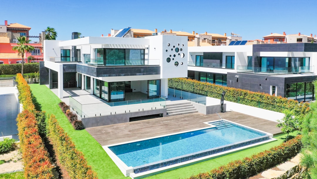 a large white house with a pool in front of it, Luxury villa situated in famous golf course in Vilamoura, Algarve, Portugal
