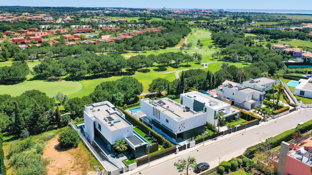 Aerial view of homes beside a golf course