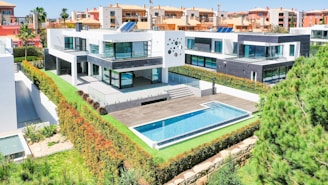 an aerial view of a house with a swimming pool