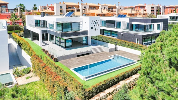 an aerial view of a house with a swimming pool