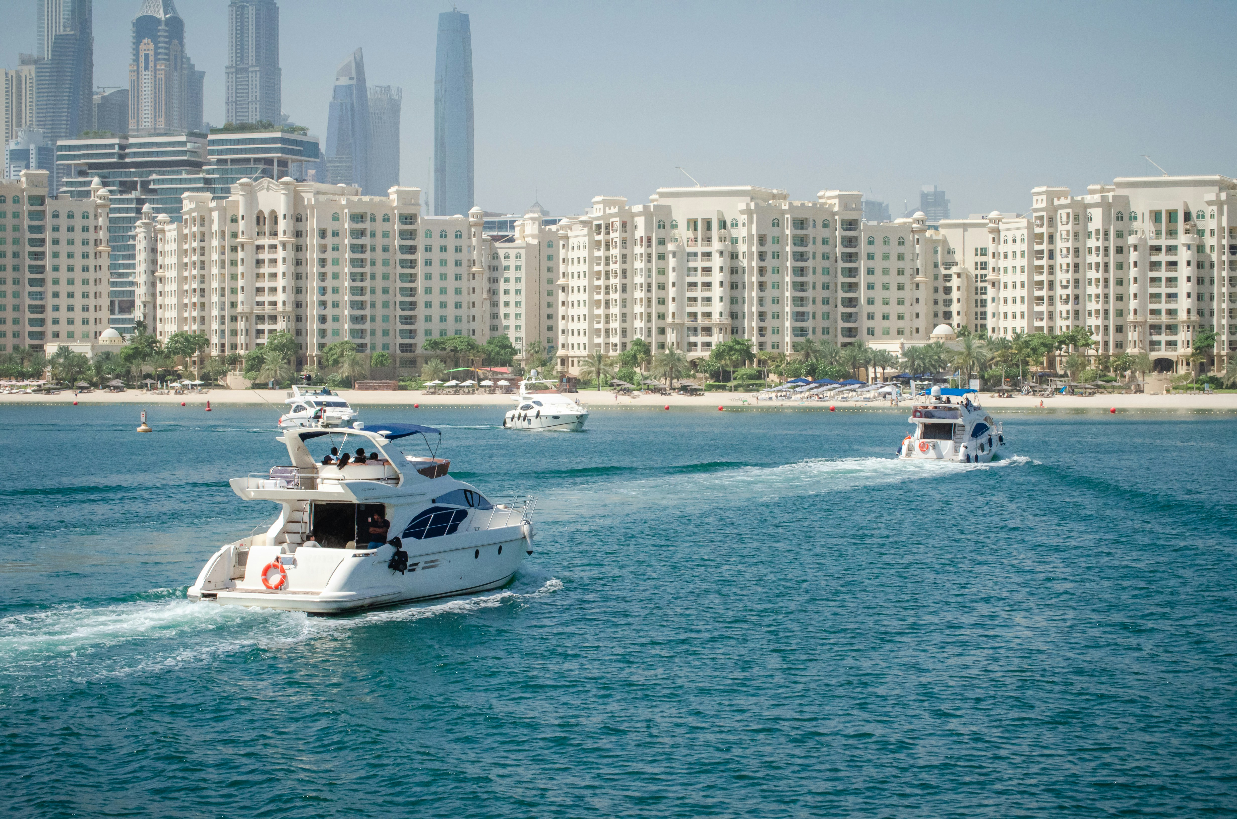 yacht cruising in the waters of dubai. unsplash image. elite pearl charter