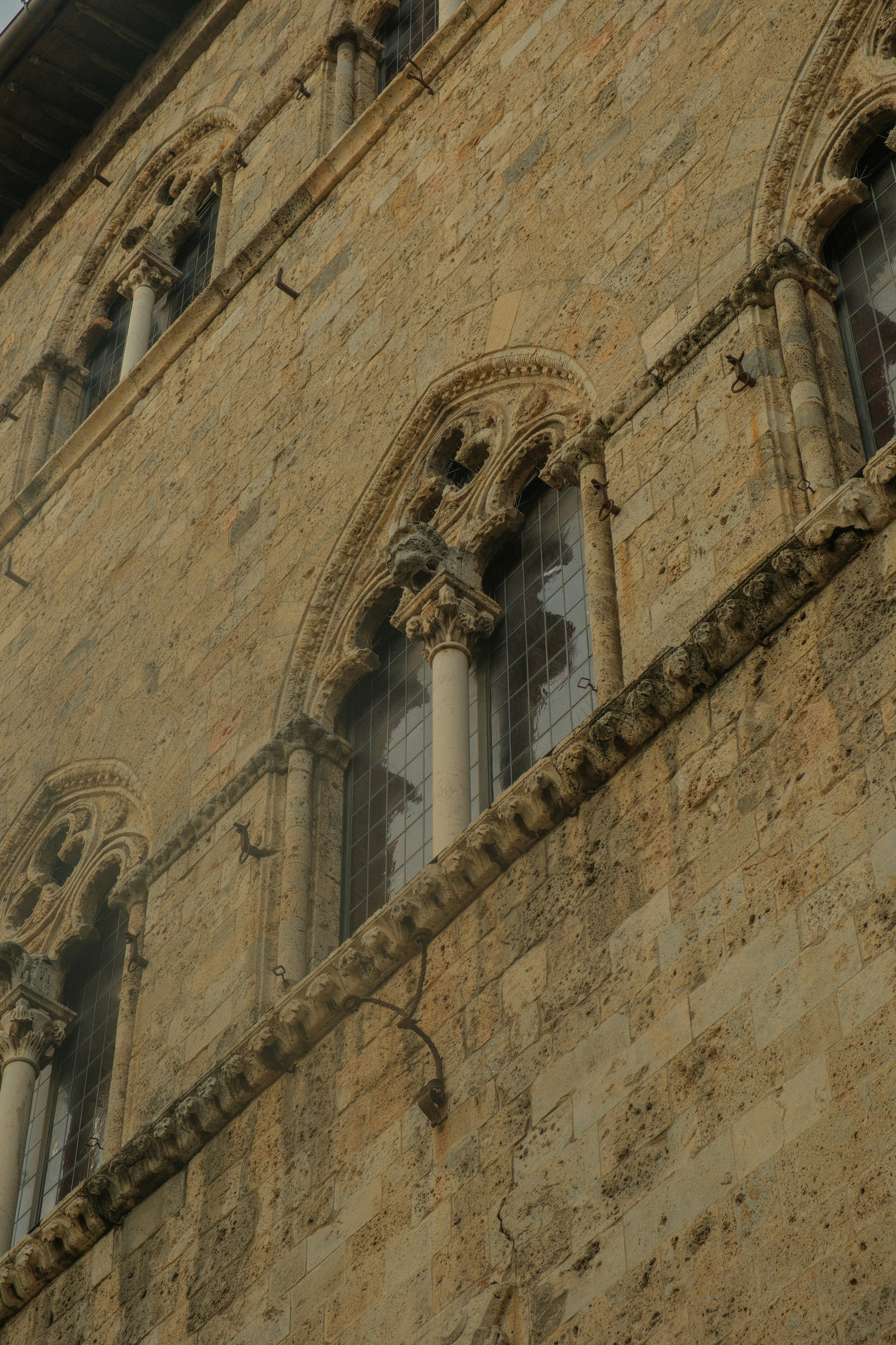 a clock on the side of a tall building