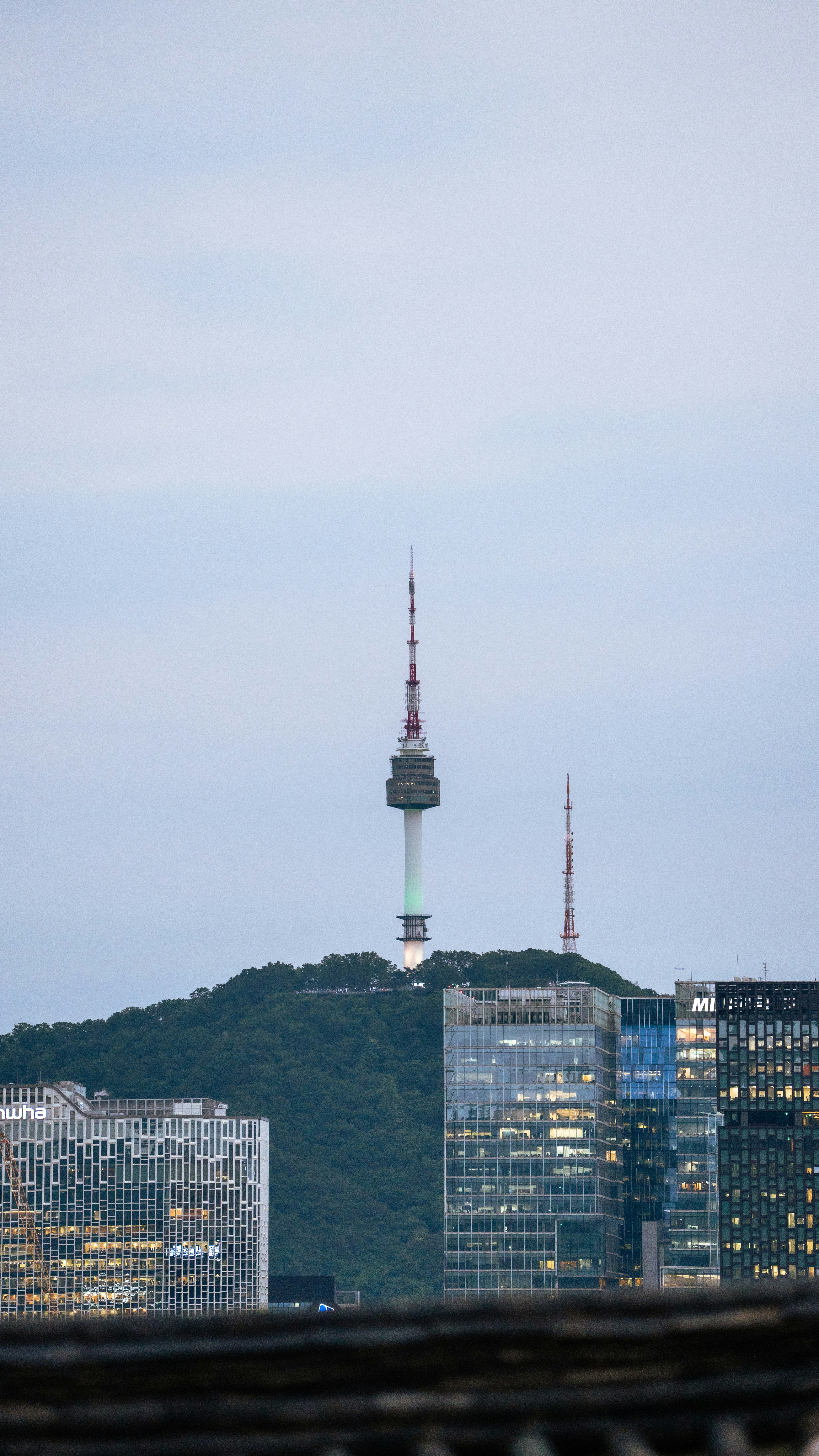 a view of a city with a tower in the background