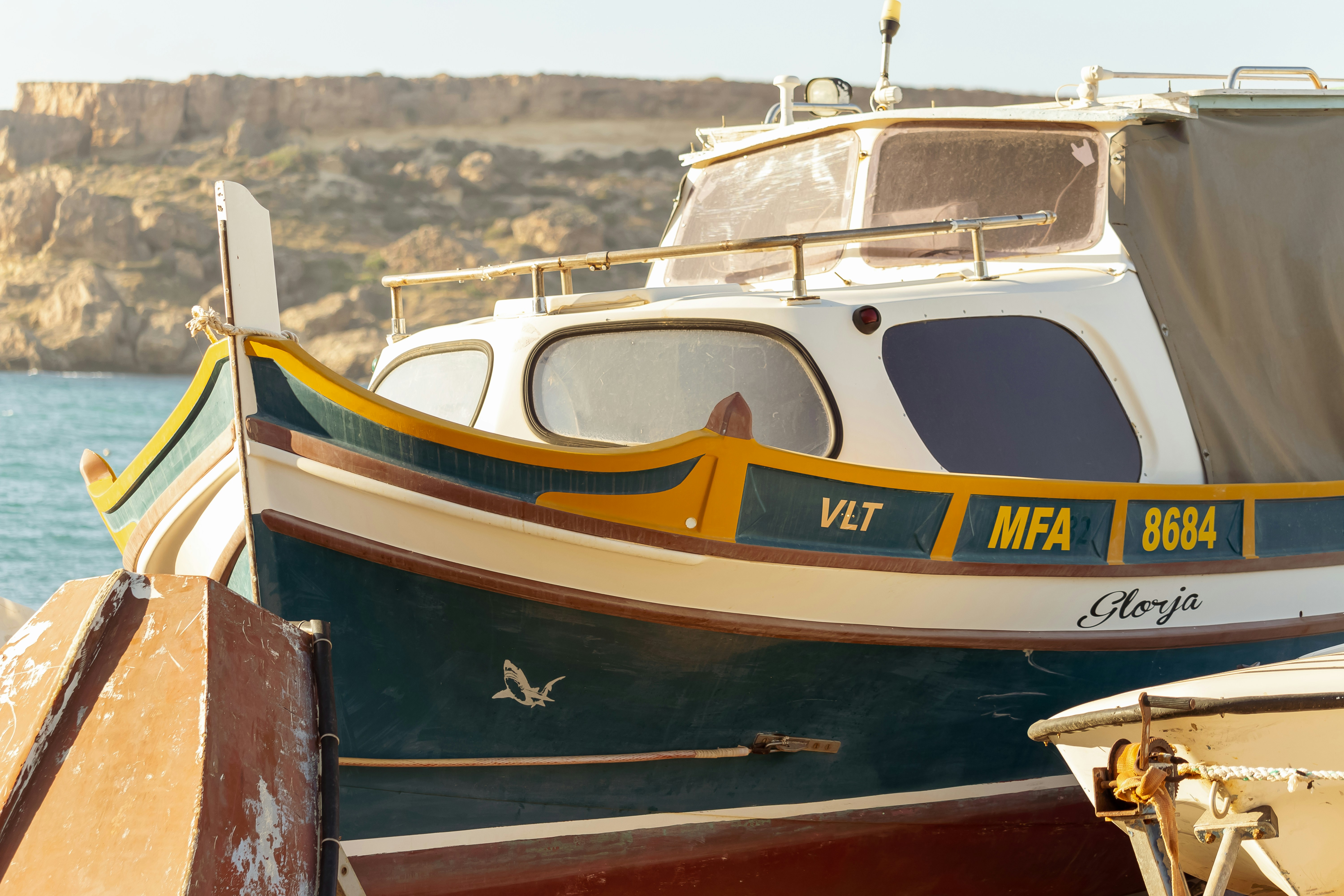 a boat sitting on top of a wooden dock