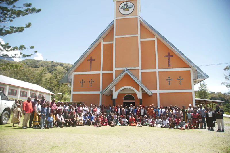 A group gathered outside a church before departure