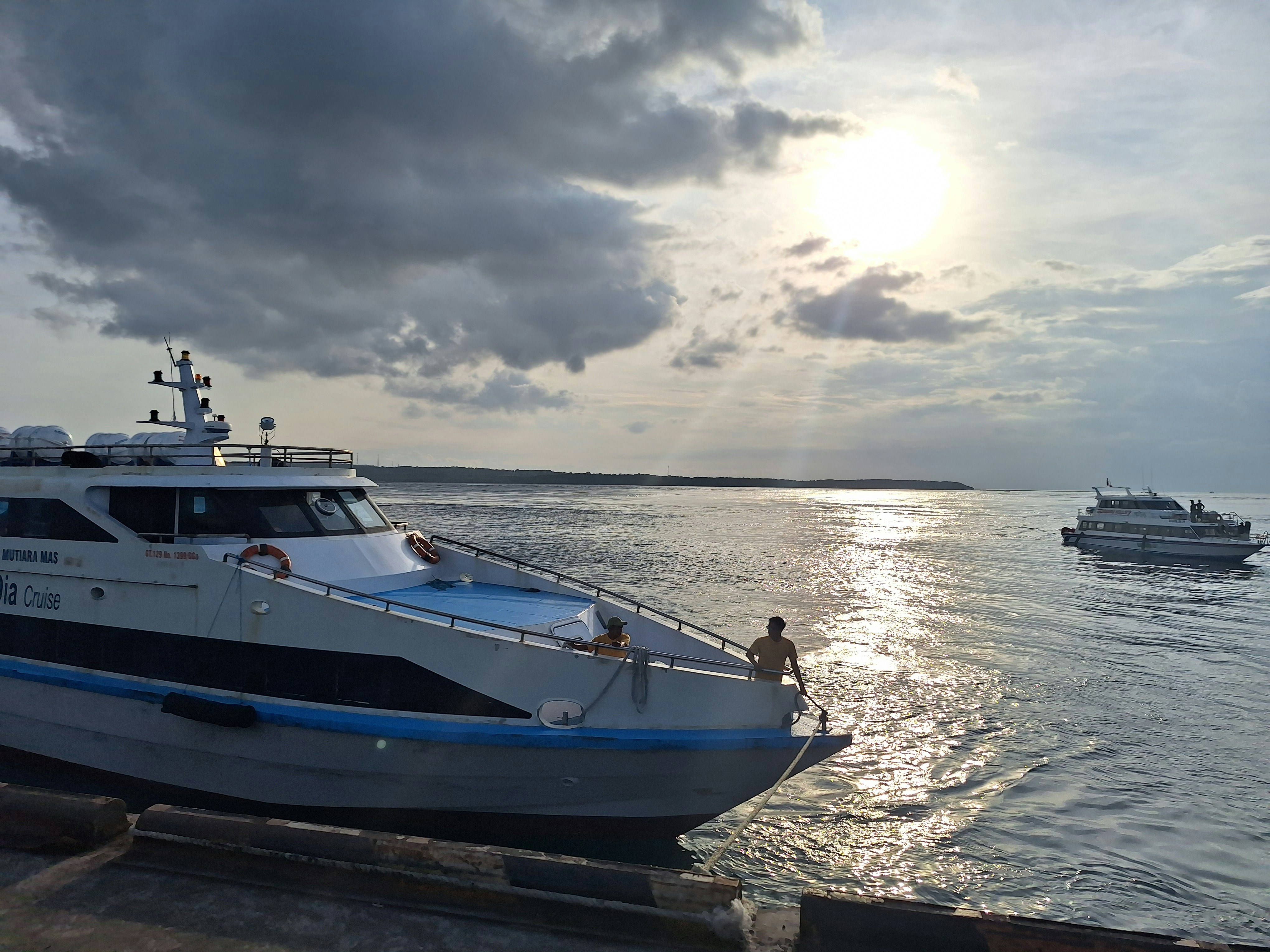 Cruise ship travel on sea during sunset.