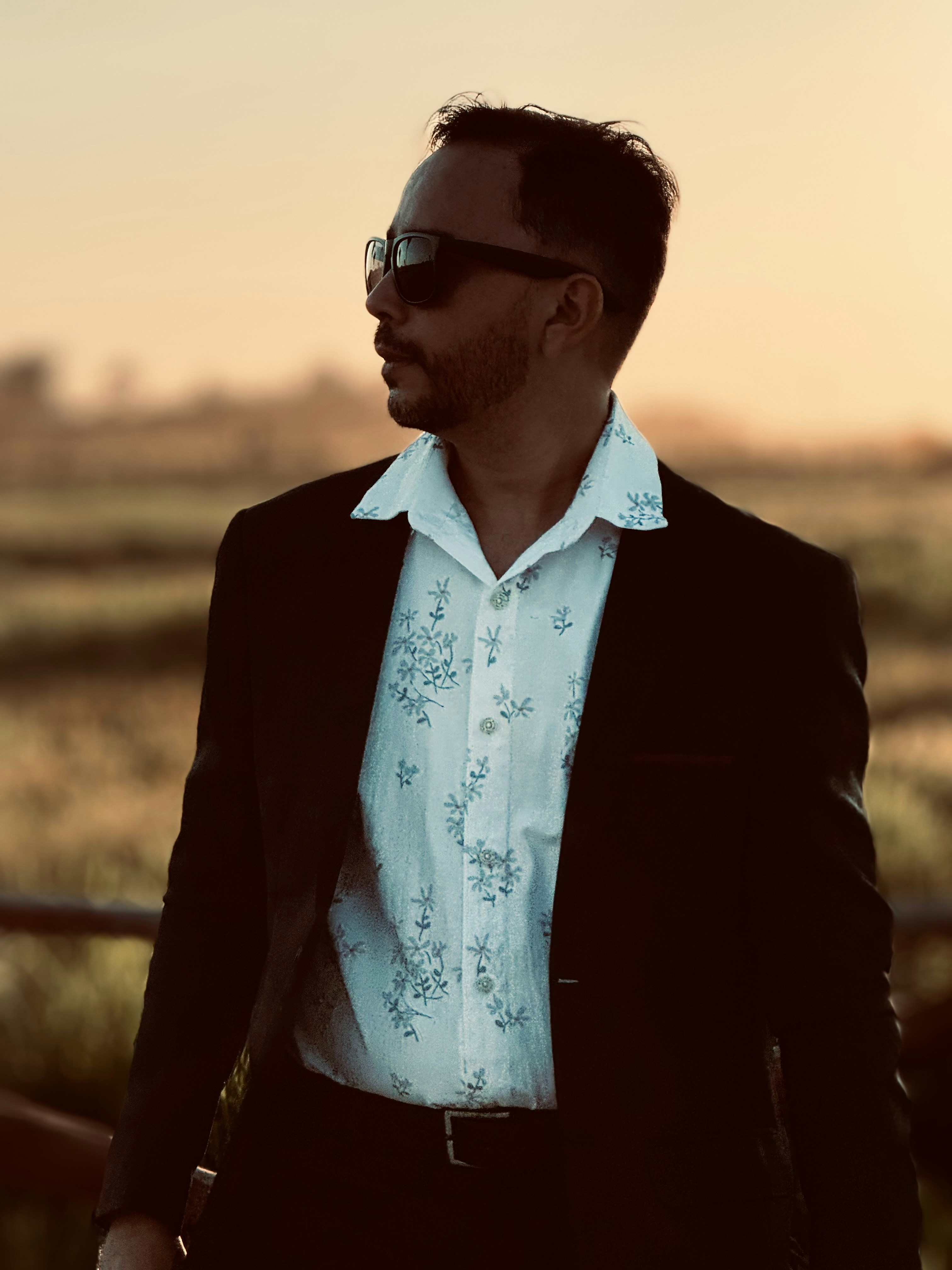 a man in a white shirt and black jacket