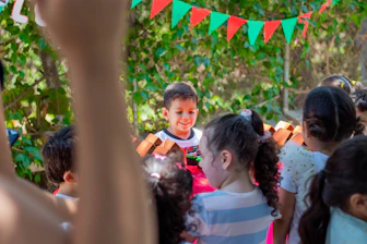 a group of young children standing next to each other
