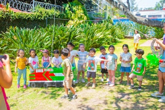 a group of children standing around each other
