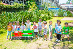 a group of children standing next to each other