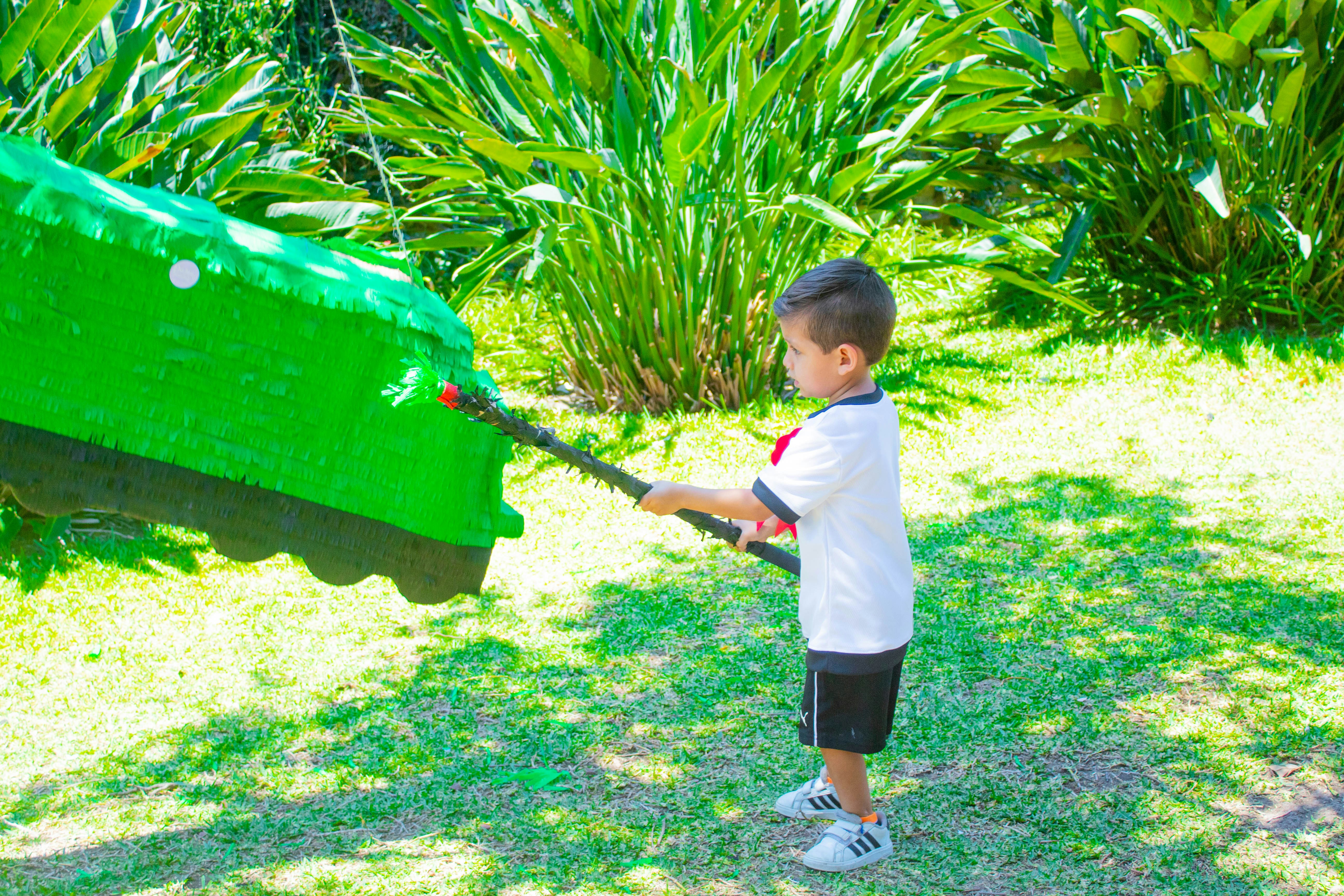 a young boy is playing with a lego boat