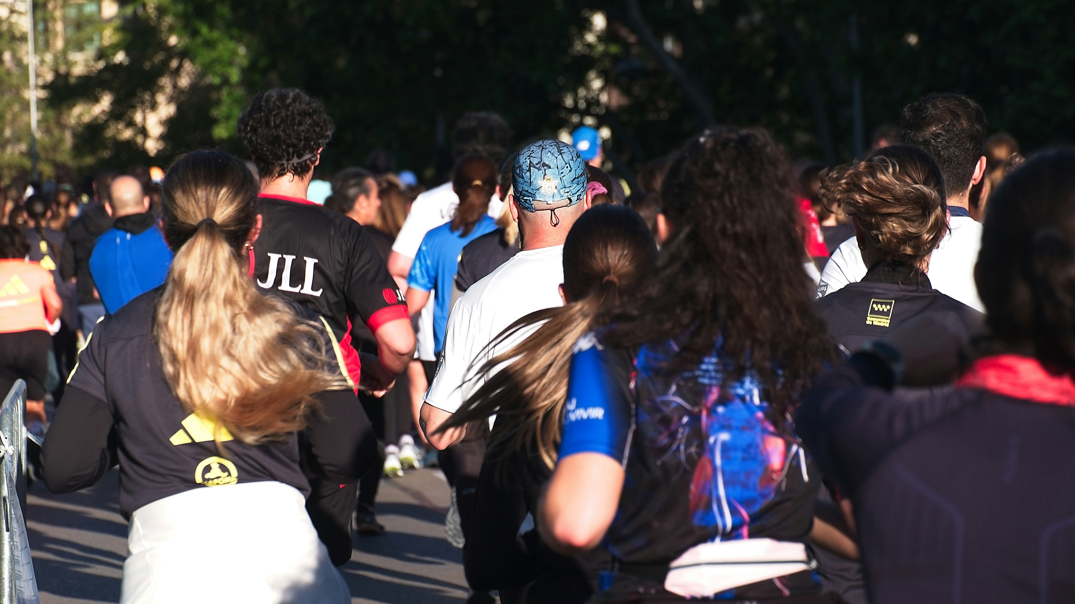a large group of people walking down a street