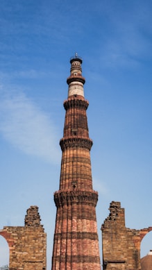 a tall brick tower with a clock on top
