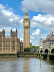 a large clock tower towering over a city