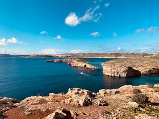 a body of water surrounded by rocky terrain