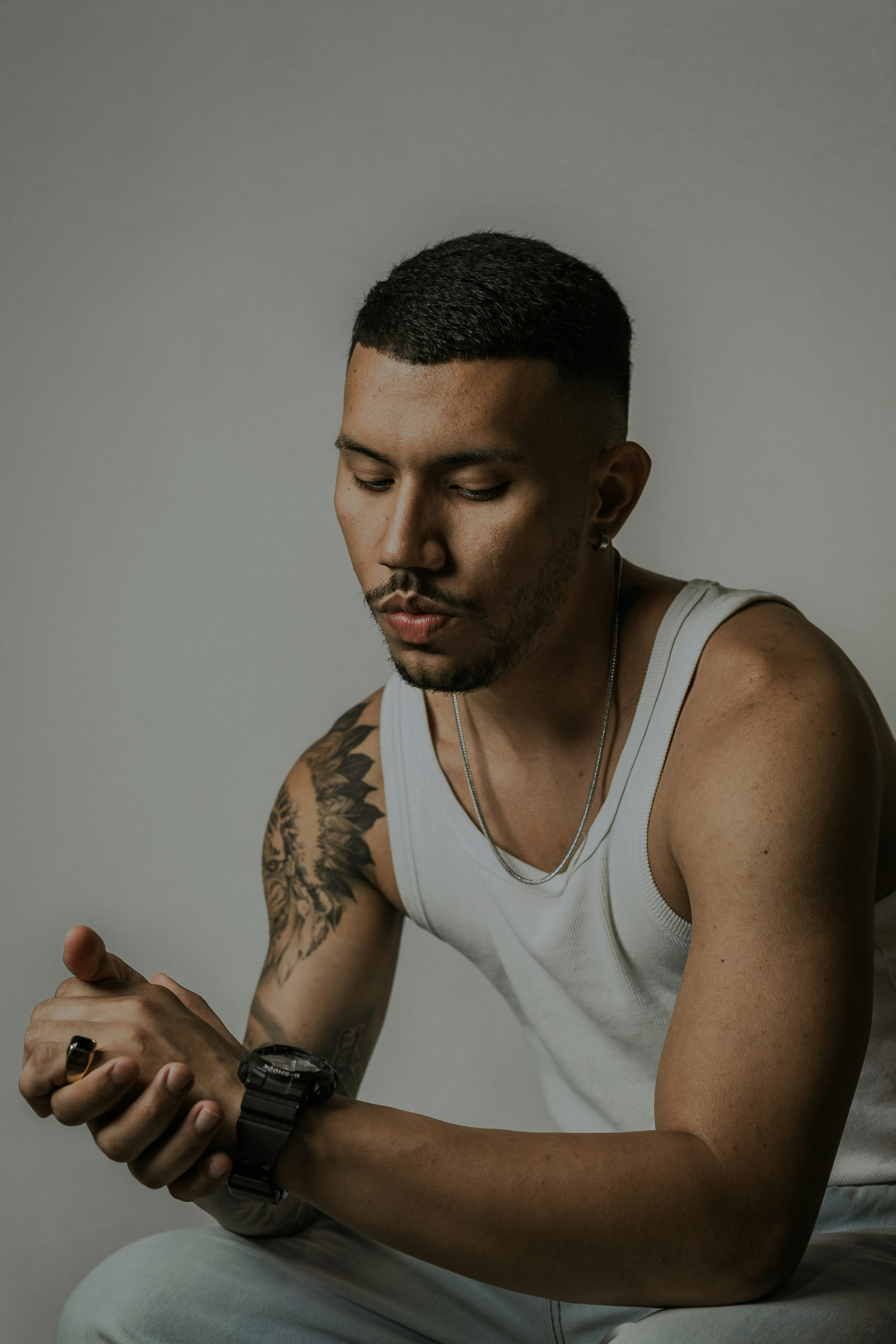 a man with a tattoo on his arm