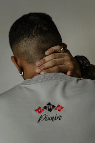 a man with his hands on his back