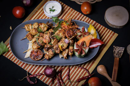 a blue plate topped with meat and vegetables