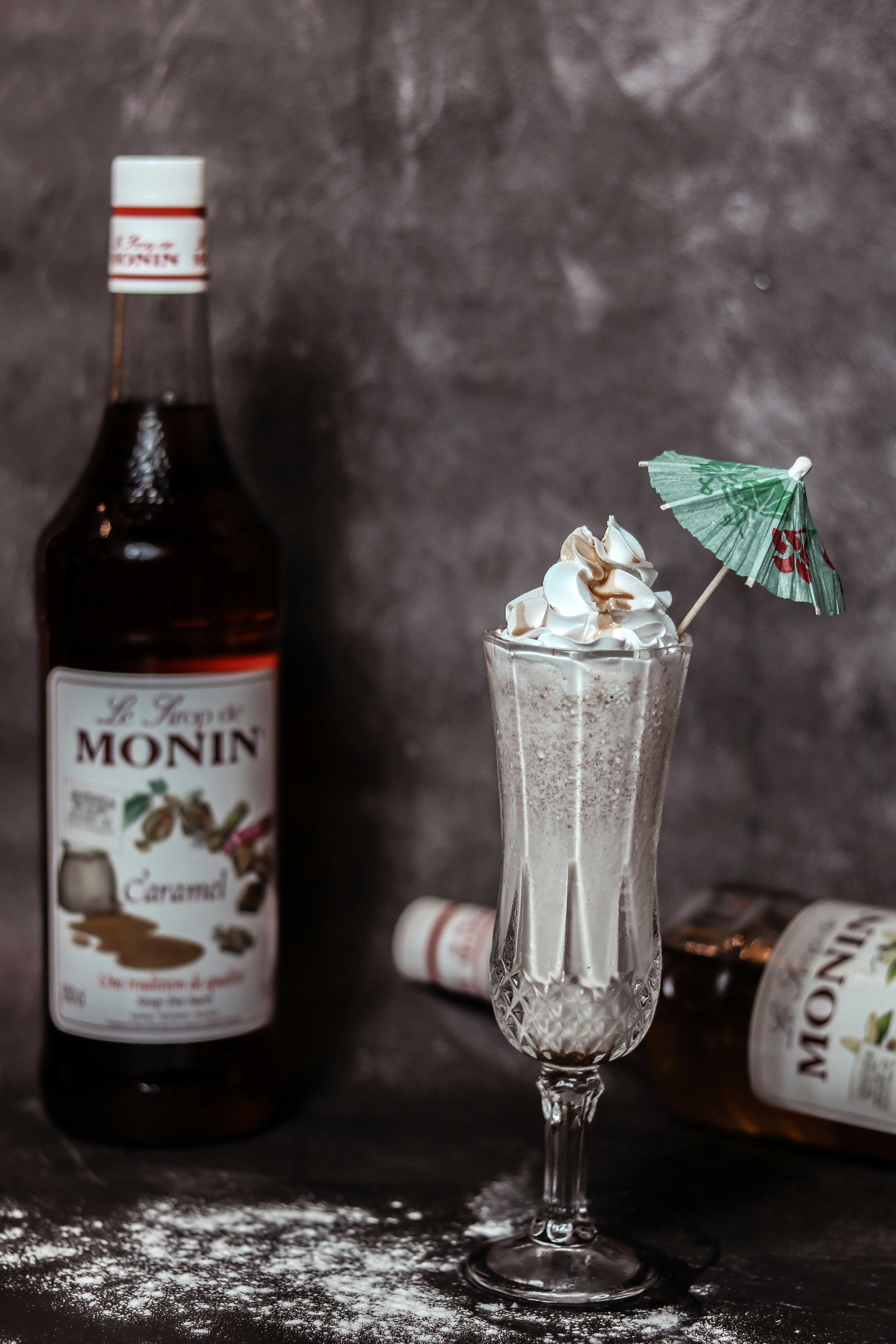 a bottle of liquor and a glass with a drink in it