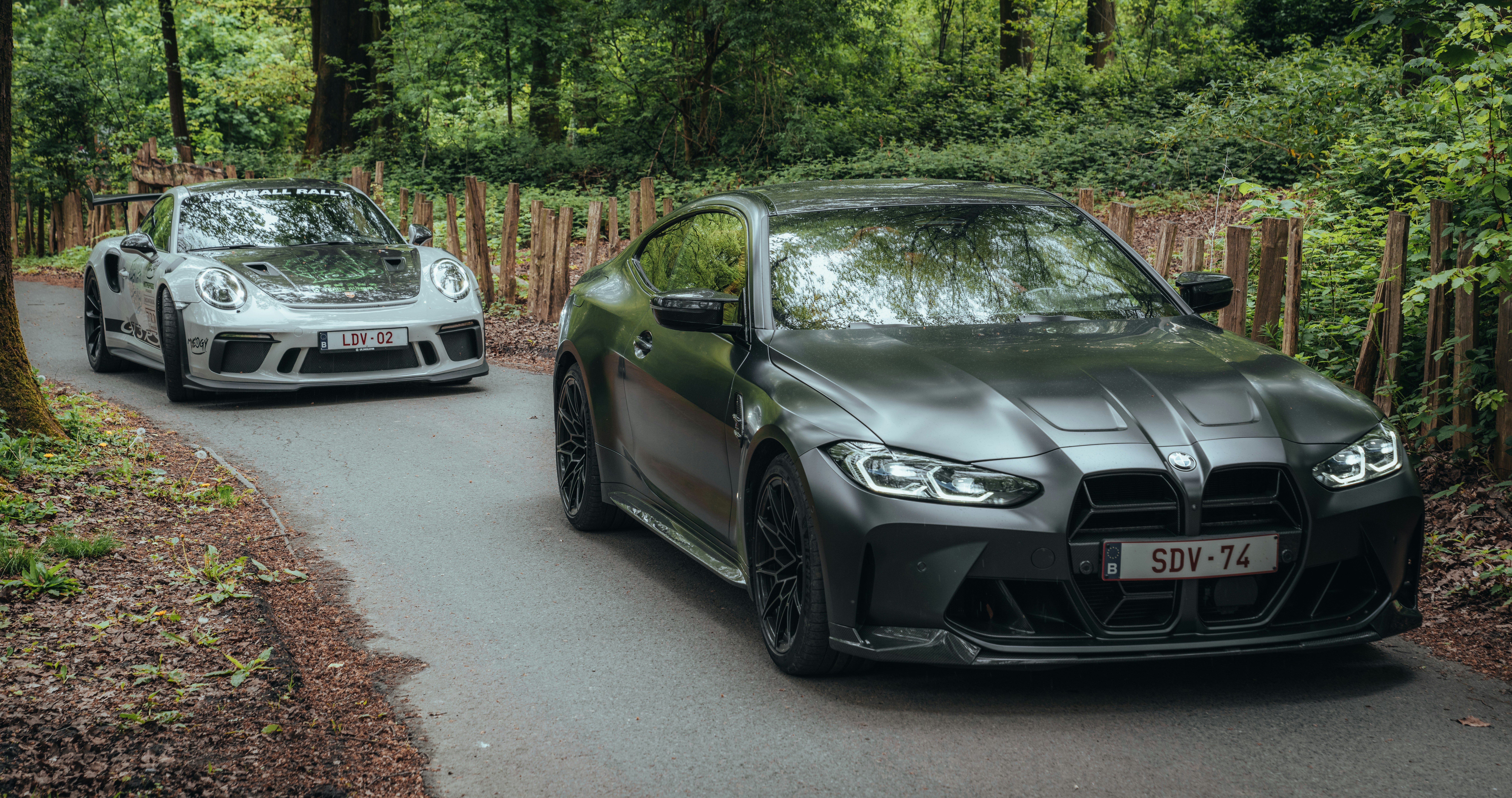 A couple of cars that are on a road photo – Free Car Image on Unsplash