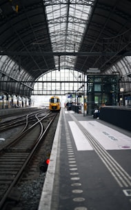 a train station with a train on the tracks
