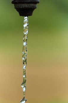 a faucet with water running down it's side
