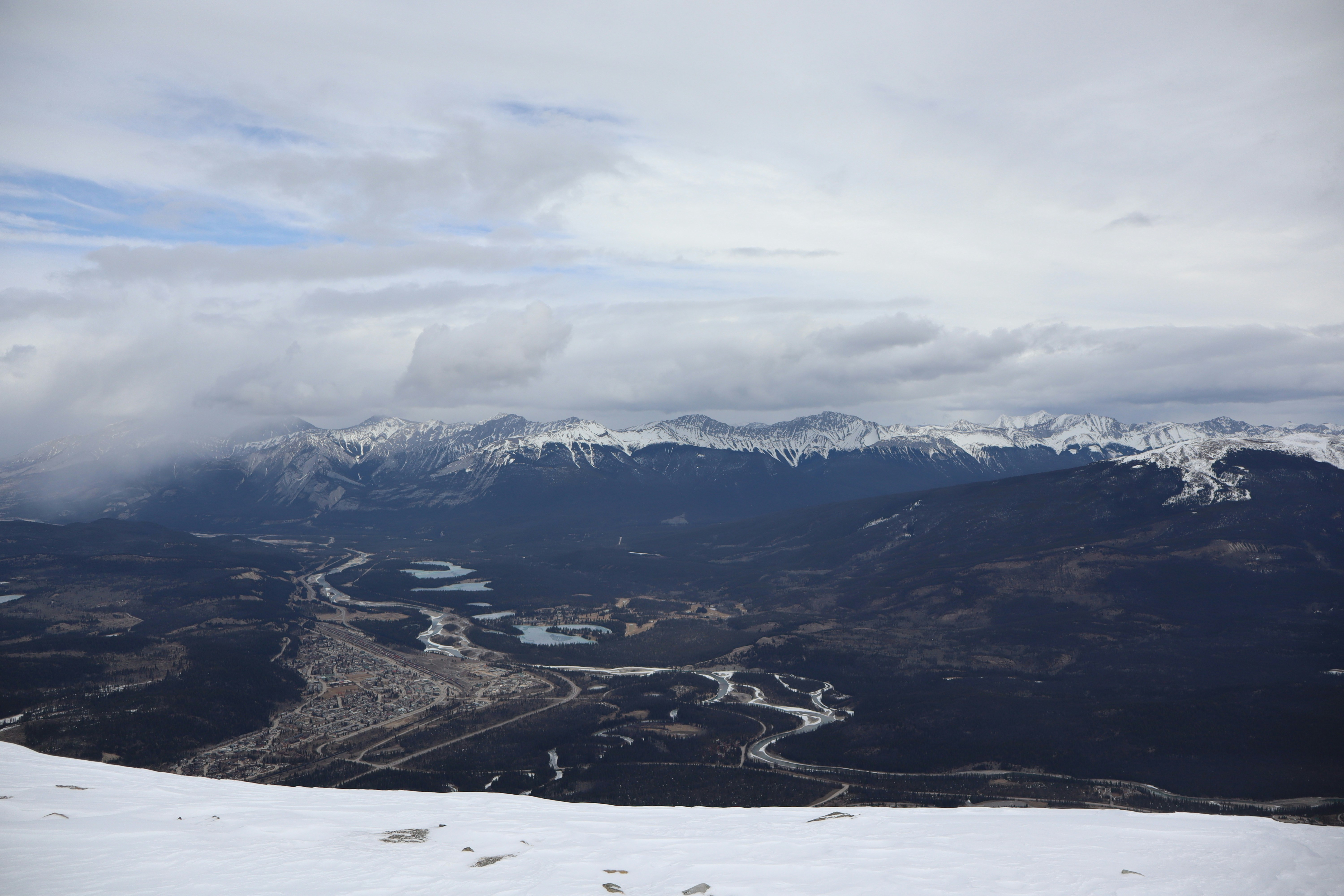 a view of a snowy mountain range from a ski slope