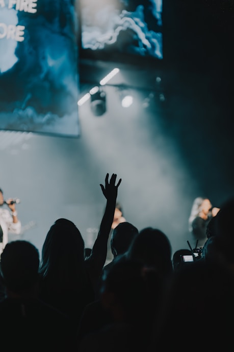 a group of people standing on top of a stage
