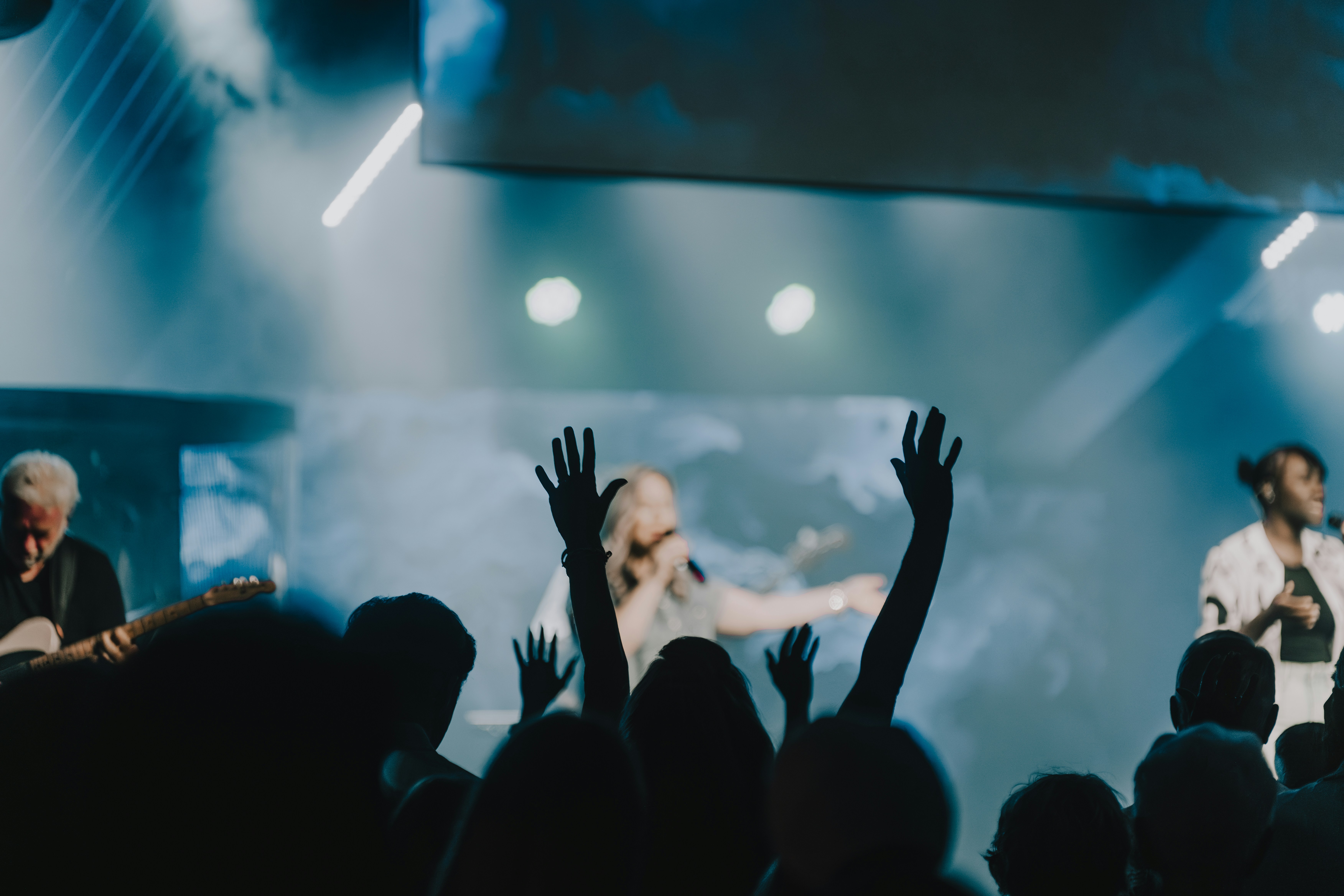 a group of people standing on top of a stage