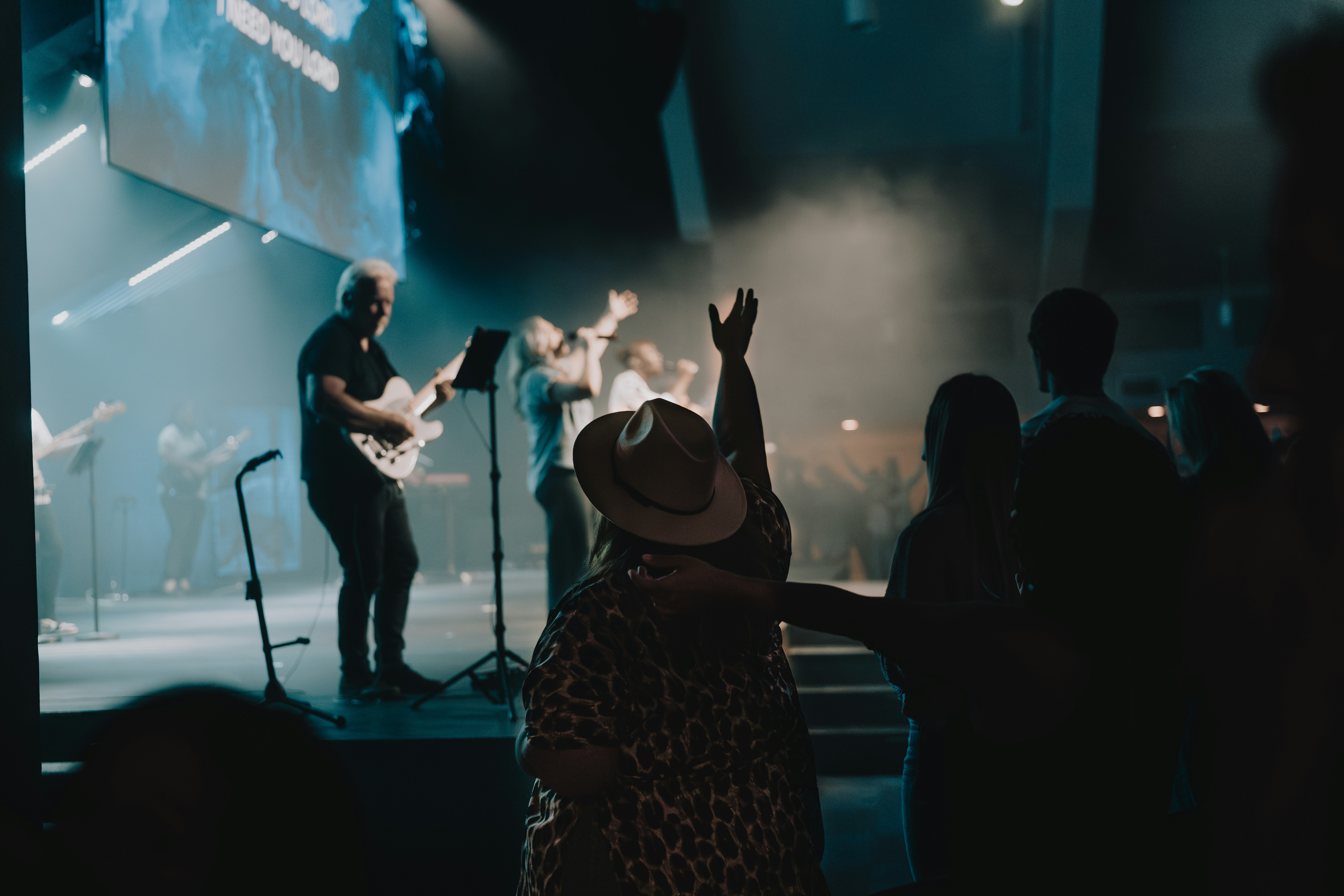 a group of people standing on top of a stage