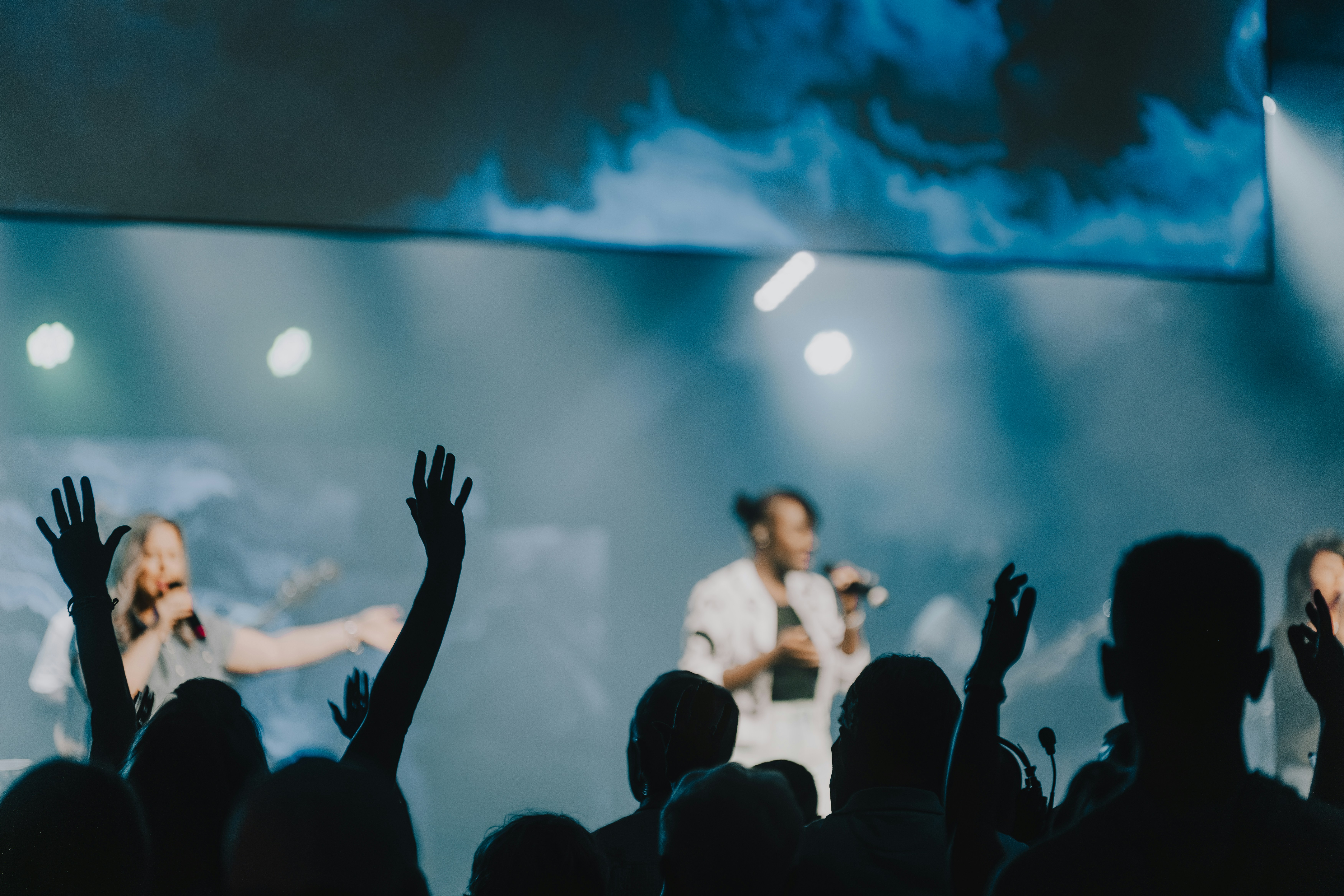 a group of people standing on top of a stage