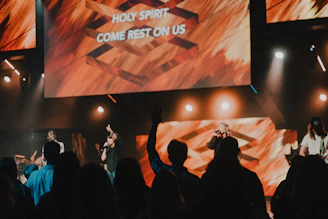 a group of people standing on top of a stage