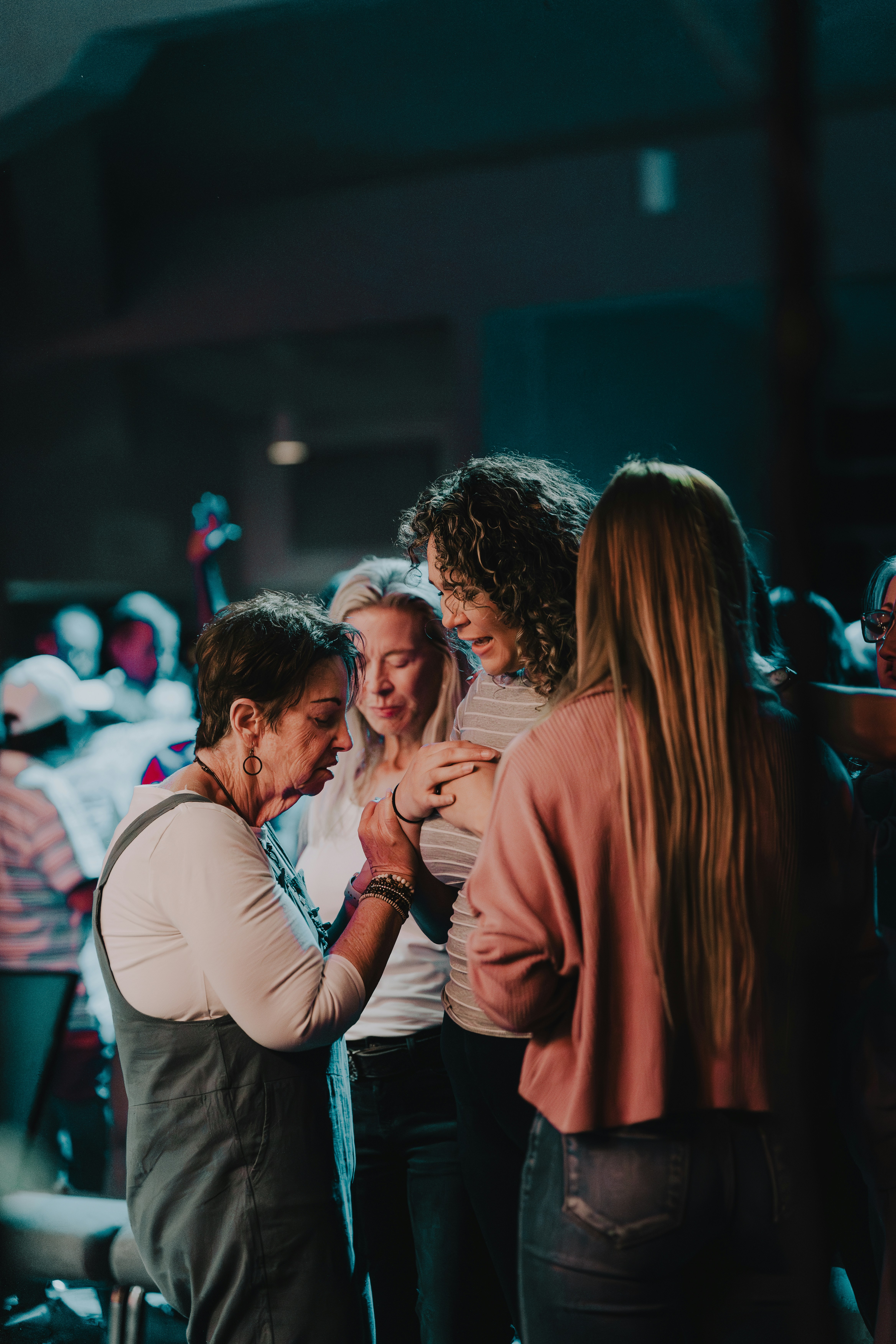 a group of women standing around each other