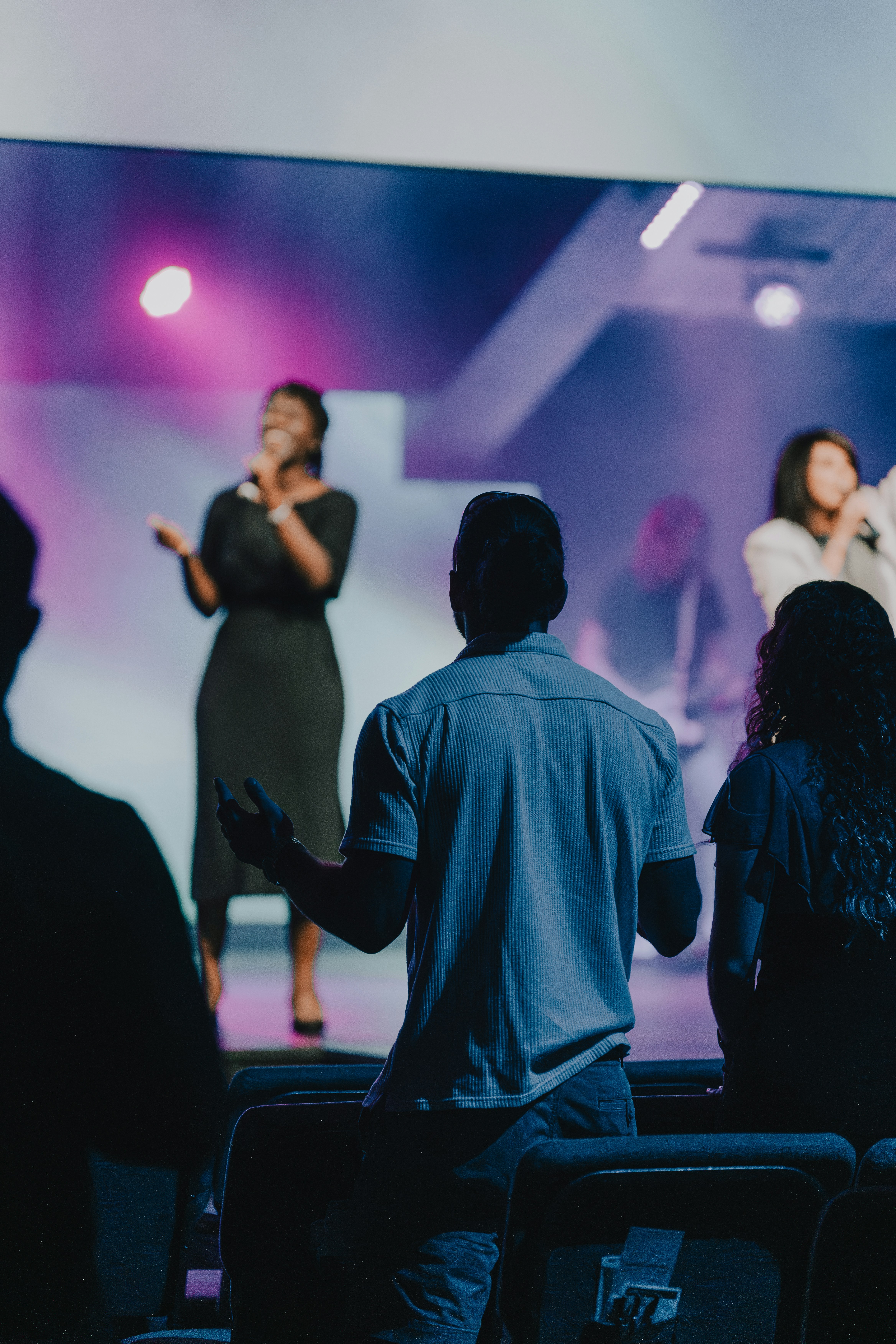a group of people standing on top of a stage