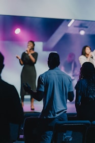 a group of people standing on top of a stage