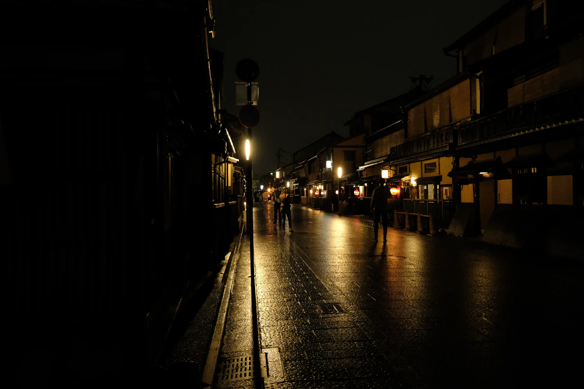 Kyoto Gion rain wet stone street lanterns night
