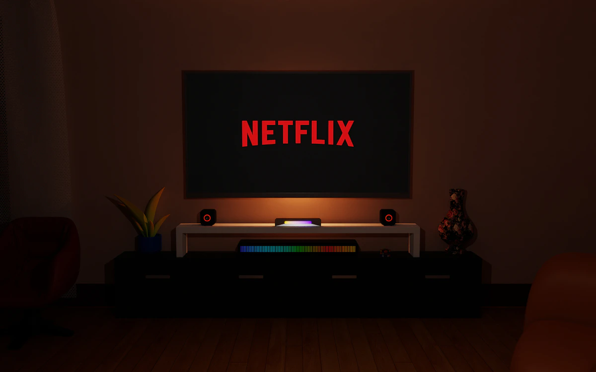 Dark living room with a television streaming a service, representing choosing the best IPTV subscription