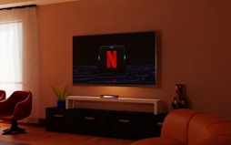 a living room with a flat screen tv on the wall