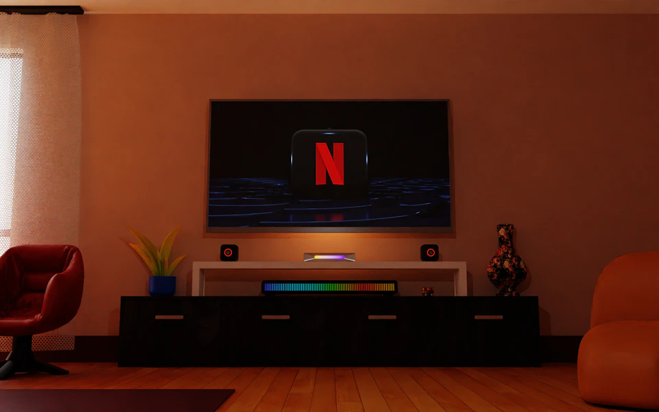 Cozy living room with flat screen TV mounted on wall displaying Netflix advertisement indoors