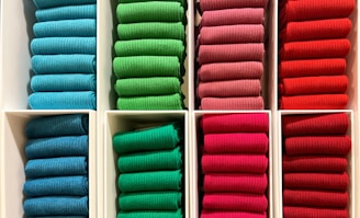 a bunch of folded towels in a box