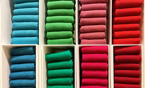 a bunch of folded towels in a box