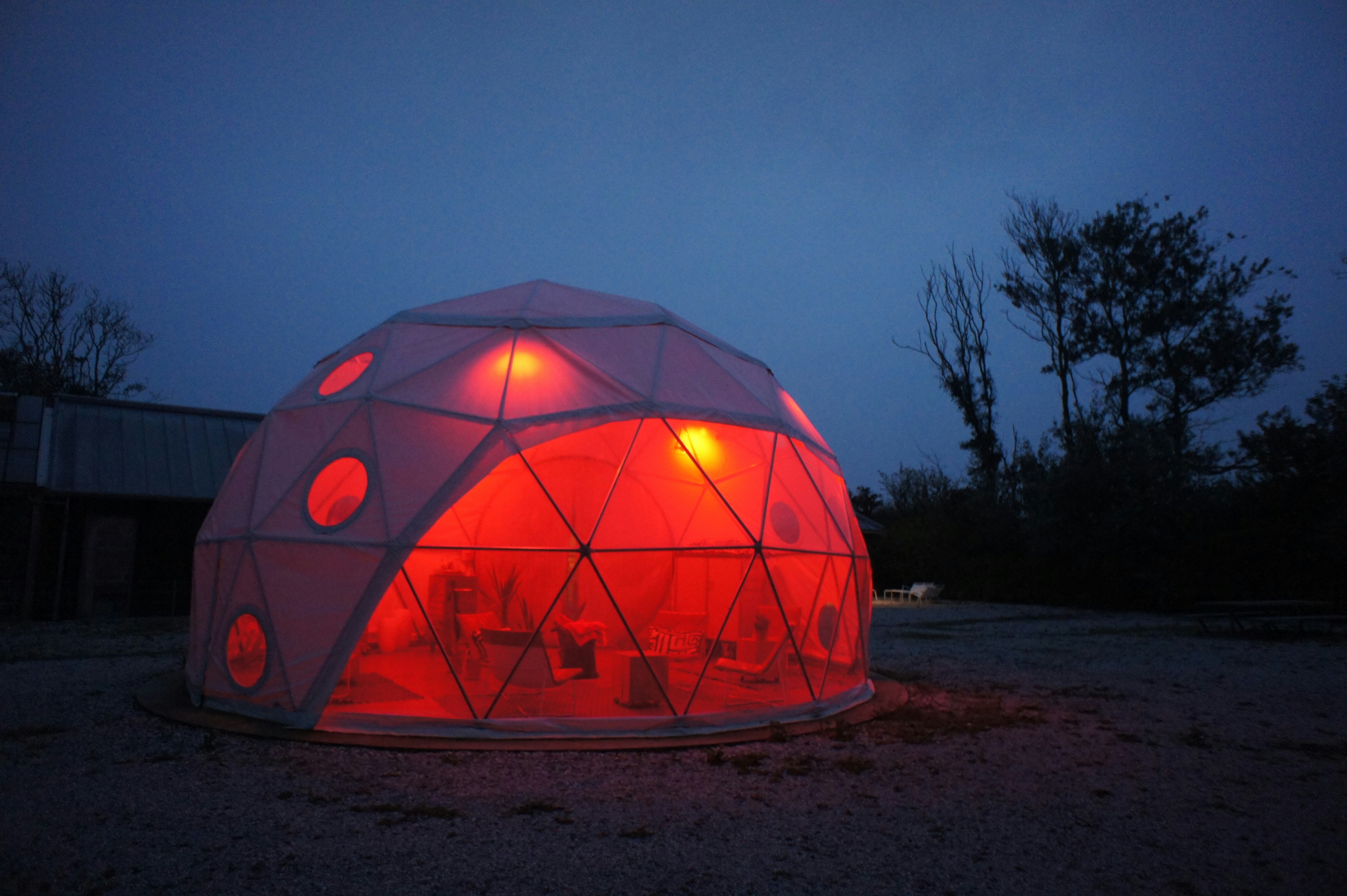 a large white dome with red lights inside